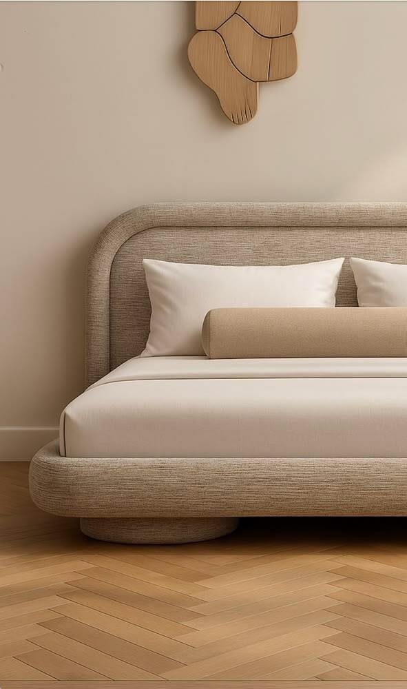 Cream upholstered platform bed with curved headboard