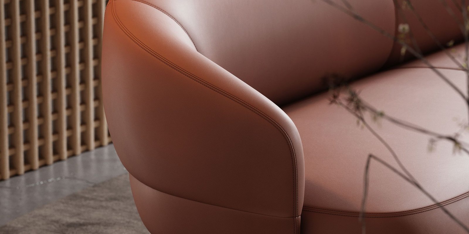 Close-up of hand-stitched leather sofa craftsmanship